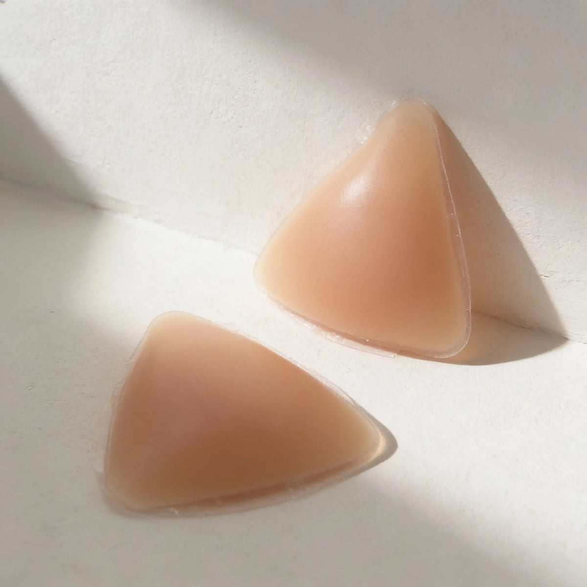A pair of triangular Plunge Inserts cut on the diagonal