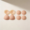 The Starter Set: a pair of inserts beside a pair of nipple covers