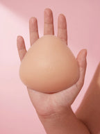 A Sculpt Insert resting across an open palm, showing its true size