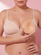 A Sculpt Insert held in one hand beside the bust